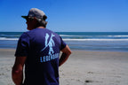 navy legendary t shirt back view beach coastal lifestyle graphic tee