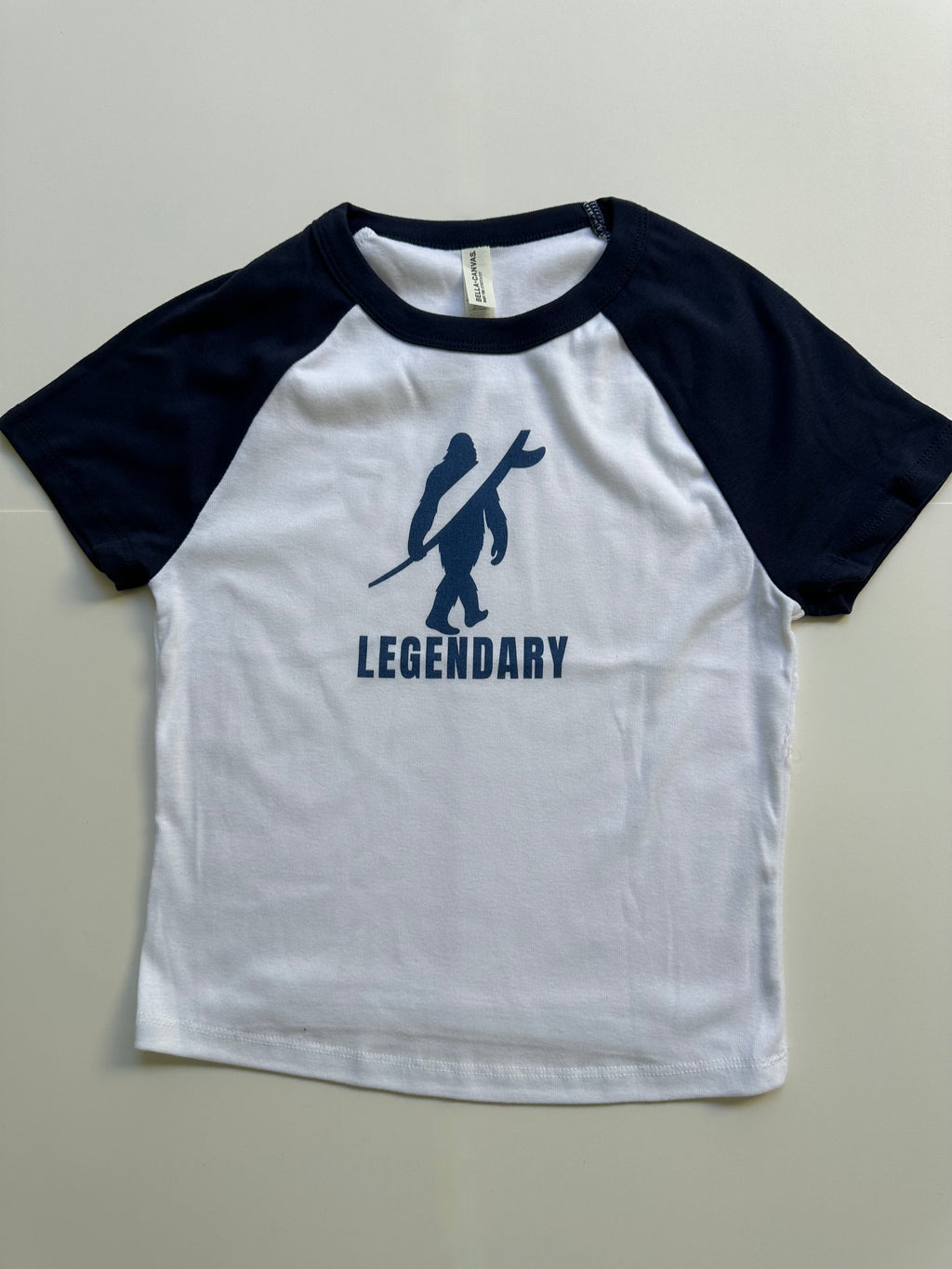 Legendary Women’s Raglan Baby Tee – Navy Blue & White
